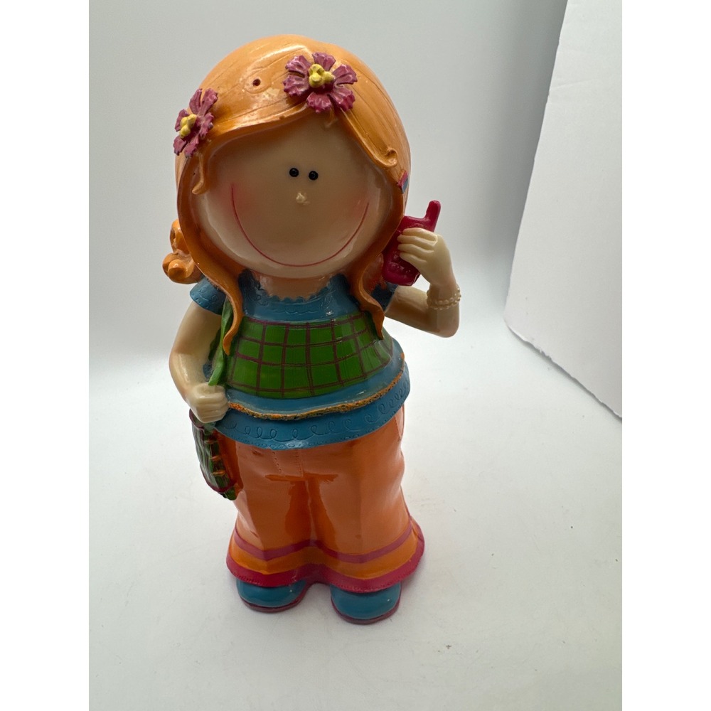 Whimsical Girl‎ Figurine Holding Phone Orange Pants Flowers missing 1 flower
